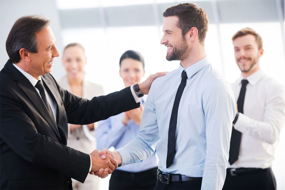 Good-Job-Two-Cheerful-Business-Men-Shaking-Hands